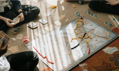 people playing board game